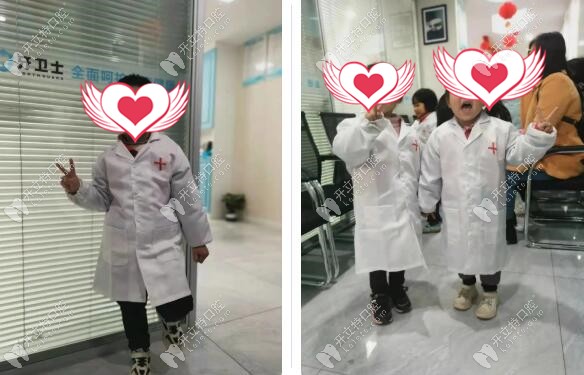 小朋友穿上白大褂進入診室 小朋友穿上白大褂進入診室